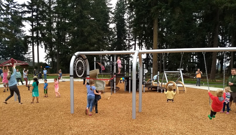Children using the playground at Otto Brown Neighborhood Park.