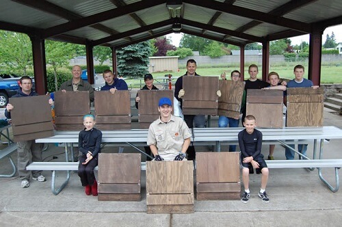 A local scout with bat boxes.