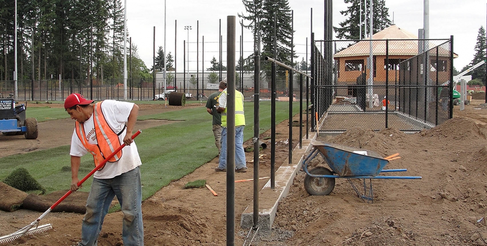 ​​Workers installing sod for a natural grass field during construction of Luke Jensen Sports Park in 2011.