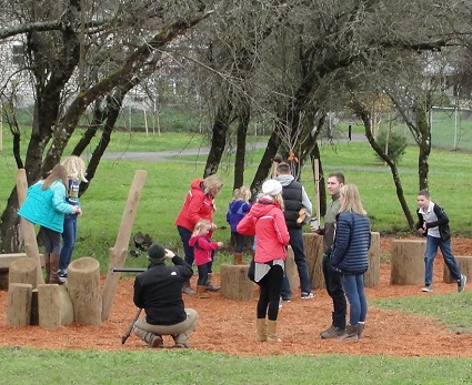 Children try out one of the &quot;nature play&quot; areas.