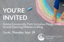 Background image is of asphalt surface with child's arms in the top right corner, drawing a rainbow with chalk. Text reads "You're invited. Felida Community Park inclusive playground grand opening ribbon cutting. 5 p.m., Thursday, Sept. 28. Clark County Public Works logo is in white in the bottom right corner. 